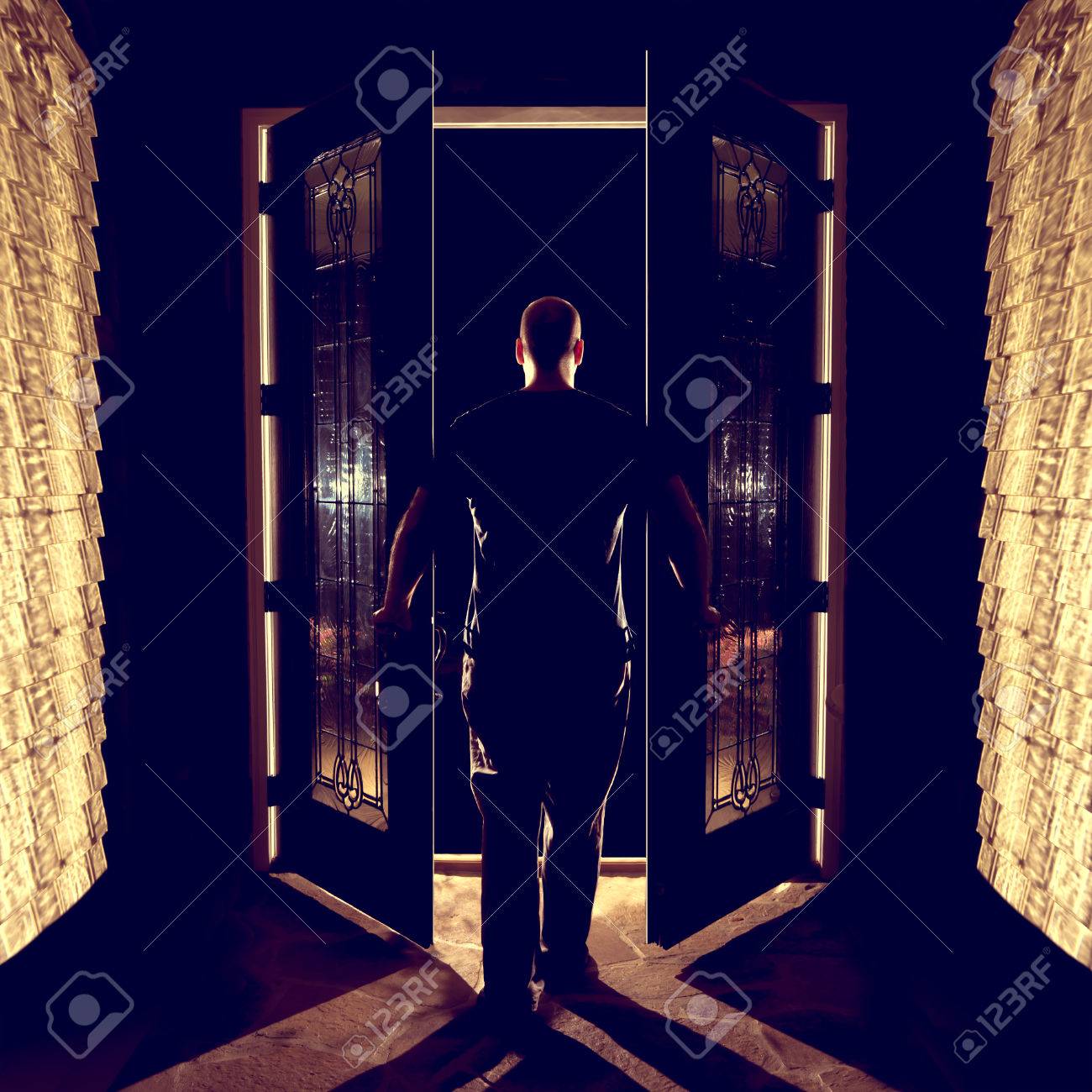 Man Opening Closing Front Double Entryway Doors With Glass In ... Man Opening Closing Front Double Entryway Doors With Glass In ...