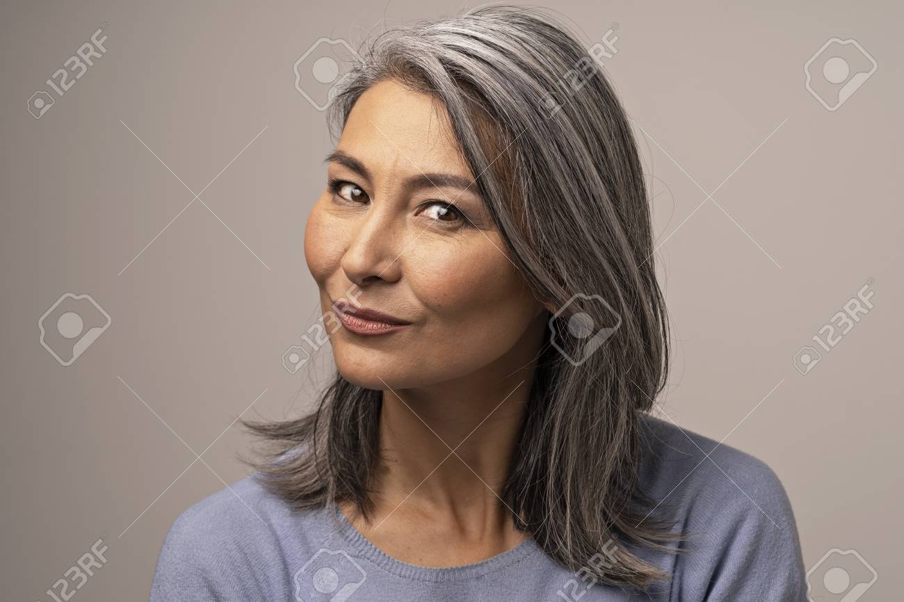 https://previews.123rf.com/images/lipik/lipik1903/lipik190300246/118958879-gray-haired-mongolian-woman-on-a-gray-background-a-pensive-smile-on-a-womans-face-mongolian-beauty-c.jpg