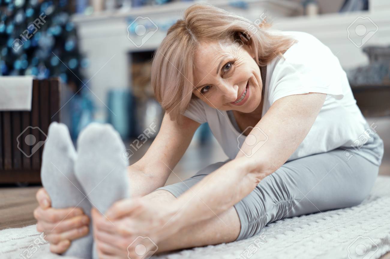 svyatoslav lipinskiyA Woman Over 50 Years Old Enjoys Yoga