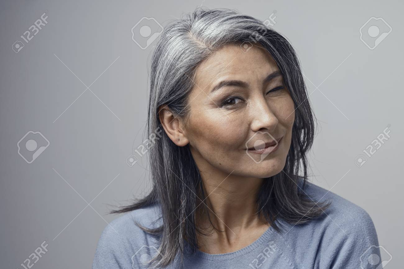 beautiful asian grey-haired women with natural make-up and cheekbones..