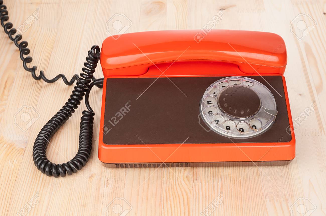 Orange Antique Phone On Wooden Desk Stock Photo, Picture And Royalty Orange antique phone on wooden desk Stock Photo - 54827939 - Orange Antique Phone On Wooden Desk Stock Photo, Picture And Royalty
