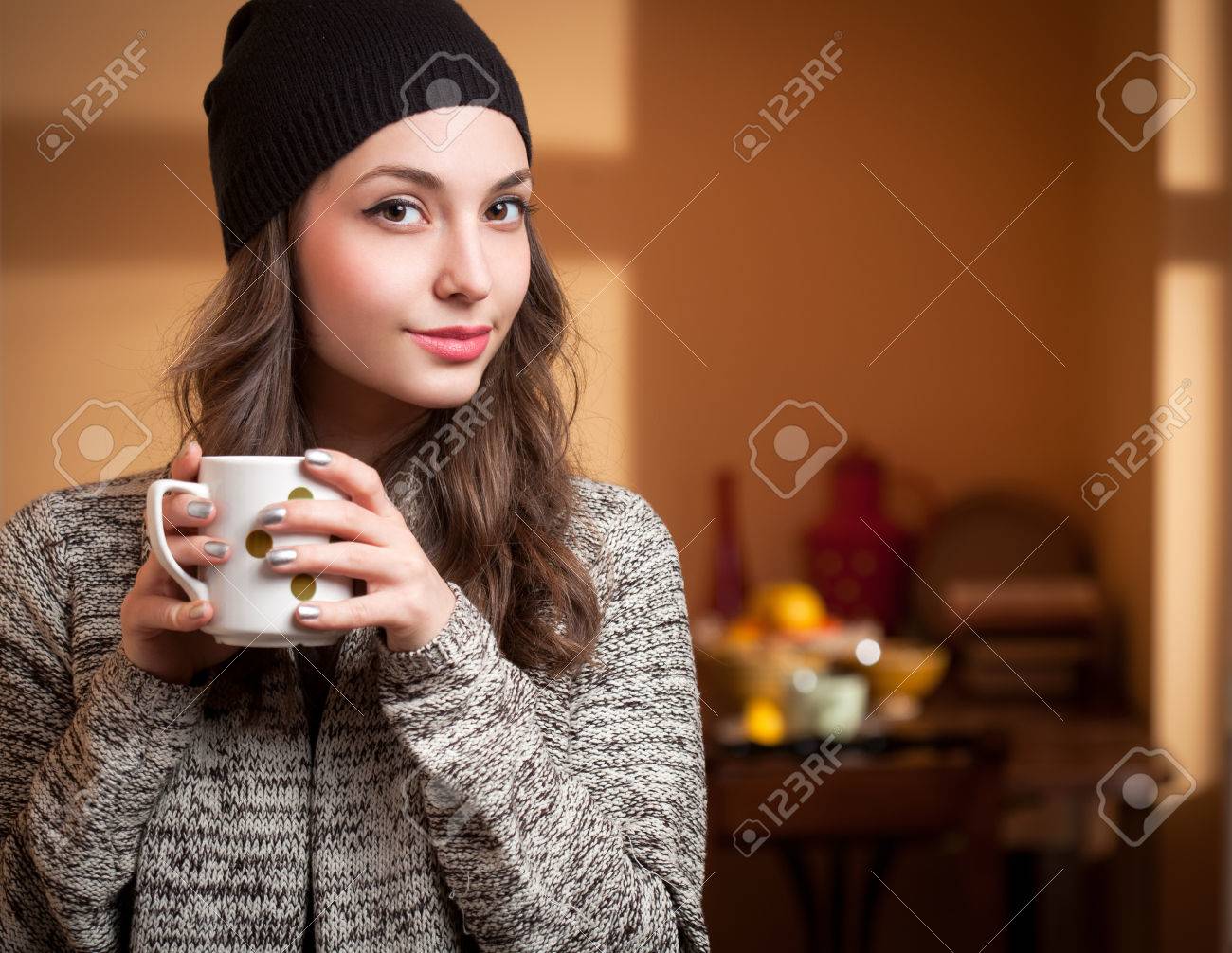 Portrait of a gorgeous young brunette relaxing with cup of hot beverage. - 38795821 Portrait of a gorgeous young brunette relaxing with cup of hot beverage. - 38795821