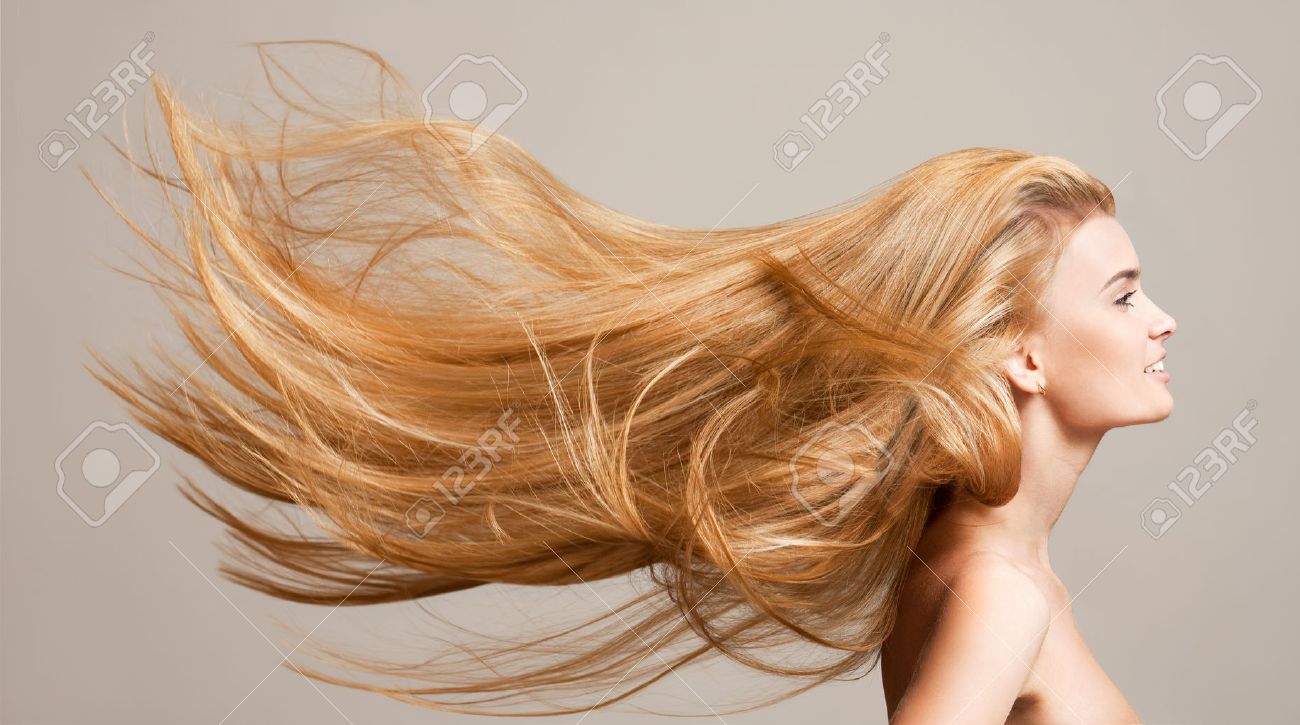 Portrait of a beautiful young blond woman with amazing flowing hair. - 52411009 Portrait of a beautiful young blond woman with amazing flowing hair. - 52411009