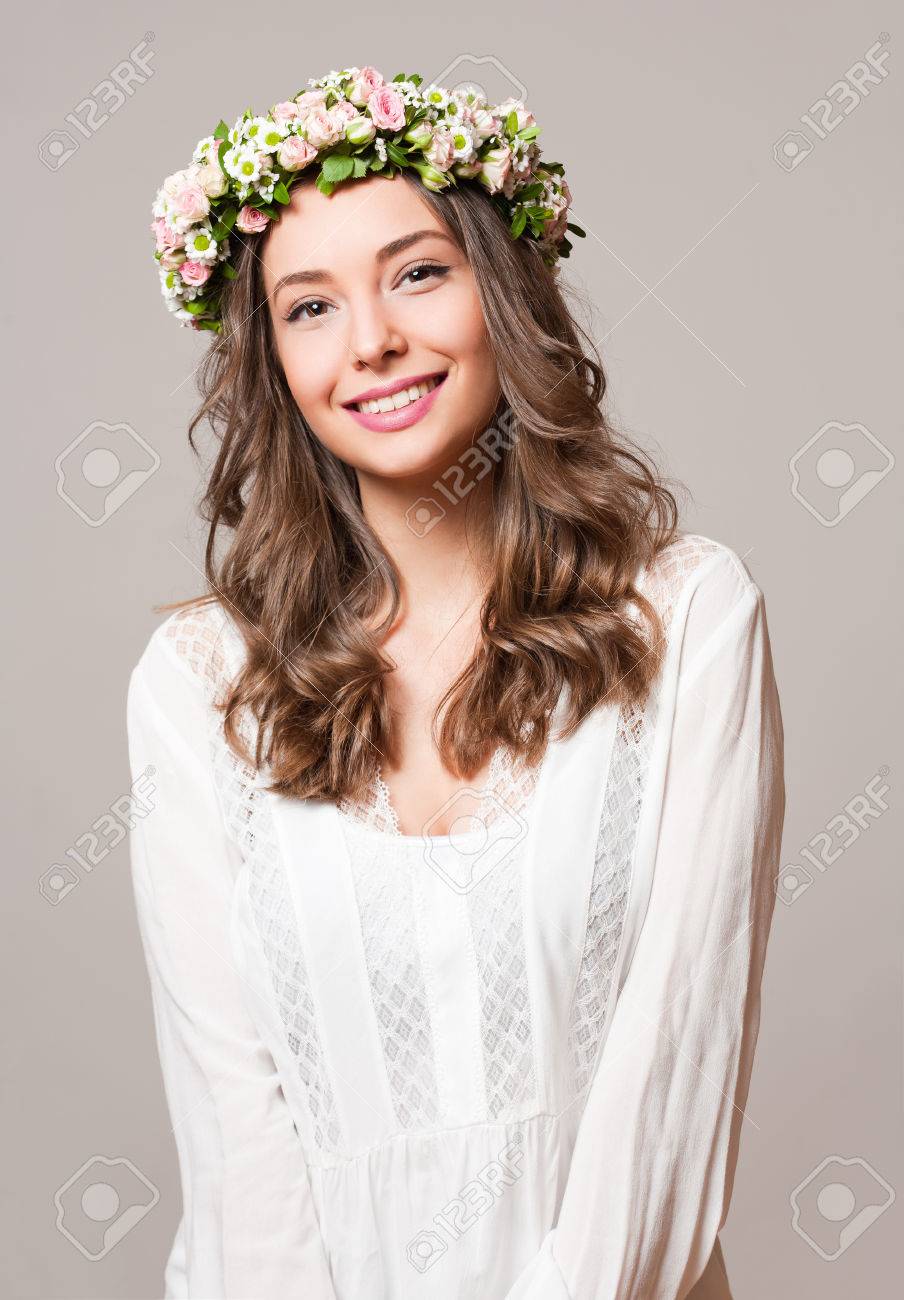 Portrait of a young spring beauty wearing flower wreath. - 55427847 Portrait of a young spring beauty wearing flower wreath. - 55427847