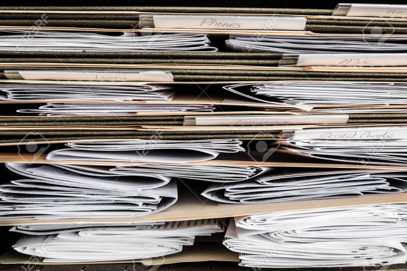 stack of papers bills invoices and financial statements in stock