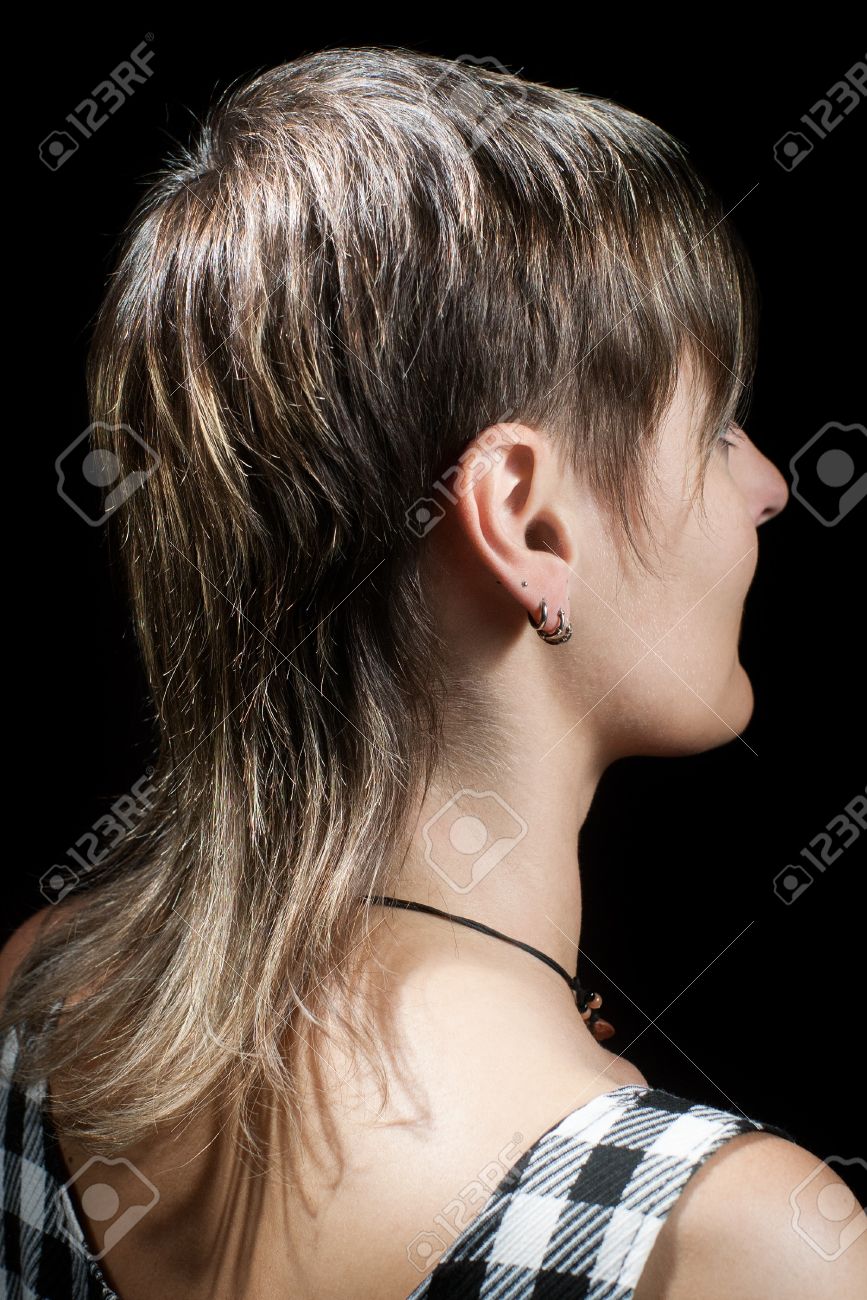 Boyish Short Haircut Of A Young Woman Viewed From Side Against