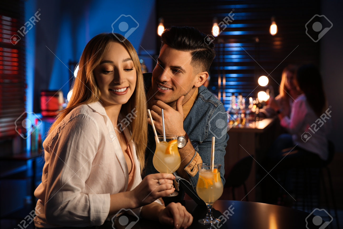 Man And Woman Flirting With Each Other In Bar Stock Photo, Picture and  Royalty Free Image. Image 202540416., image size:1300x867