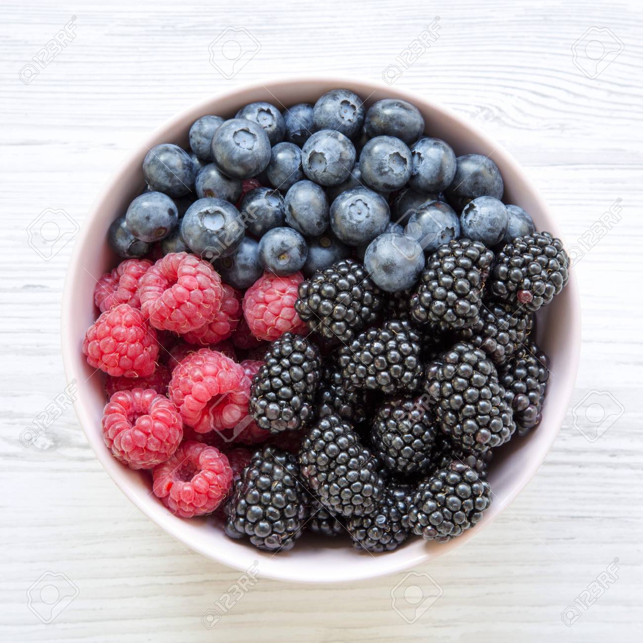 Pink Bowl Of Fresh Berries: Blackberry, Raspberry, Blueberry,.. Stock Photo, Picture And Royalty Free Image. Image 109287731.