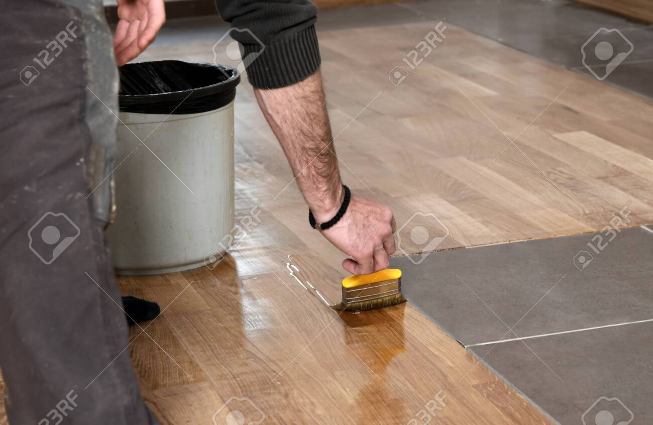 Varnishing Lacquering Parquet Floor By Paintbrush Second Layer