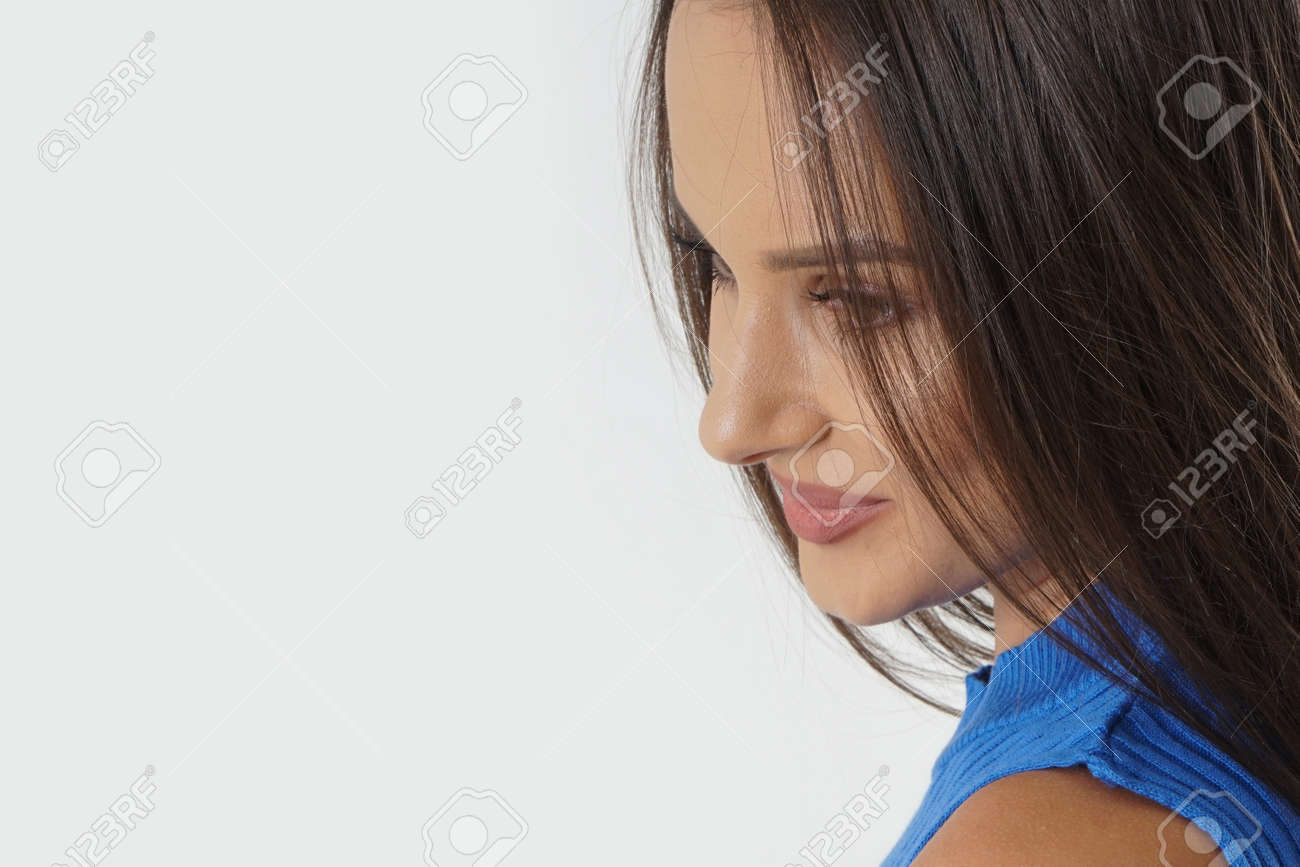 Portrait of an emotionally beautiful woman laughing while looking to the side. Beauty face portrait. Beautiful model girl with perfect fresh clean skin. Concept for youth and skin care - 166482589 Portrait of an emotionally beautiful woman laughing while looking to the side. Beauty face portrait. Beautiful model girl with perfect fresh clean skin. Concept for youth and skin care - 166482589