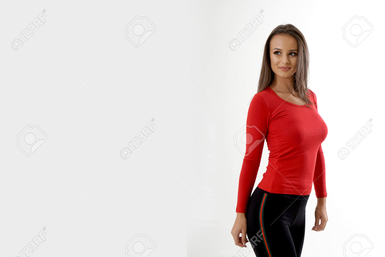 Portrait of an emotionally beautiful woman laughing while looking to the side. Beauty face portrait. Beautiful model girl with perfect fresh clean skin. Girl with red blouse and black tracksuits - 166560970 Portrait of an emotionally beautiful woman laughing while looking to the side. Beauty face portrait. Beautiful model girl with perfect fresh clean skin. Girl with red blouse and black tracksuits - 166560970