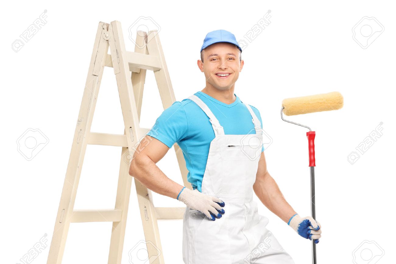 male house painter in a clean white overalls holding a paint stock house painter