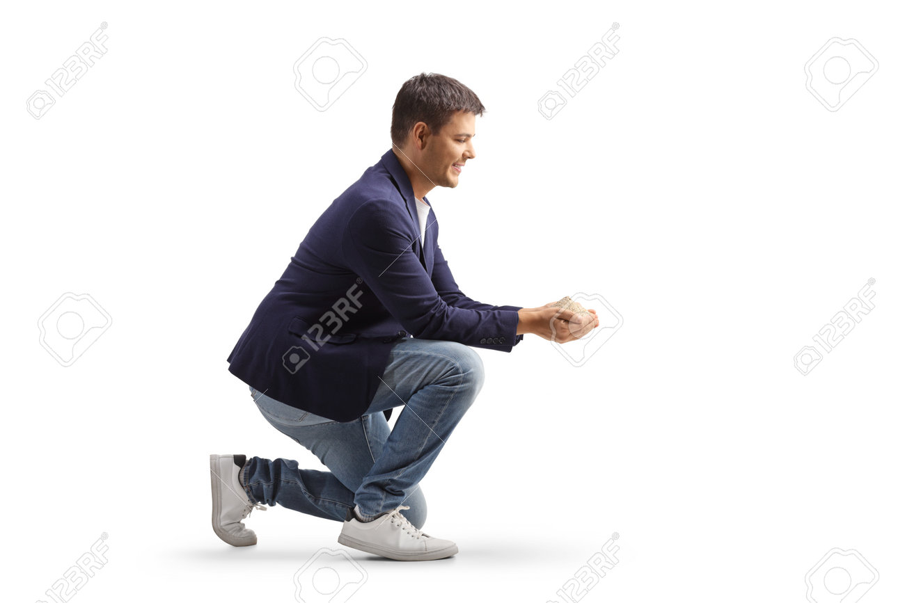 Man Kneeling And Holding A Dust In His Hands Isolated On White Background  Stock Photo, Picture and Royalty Free Image. Image 197884138.