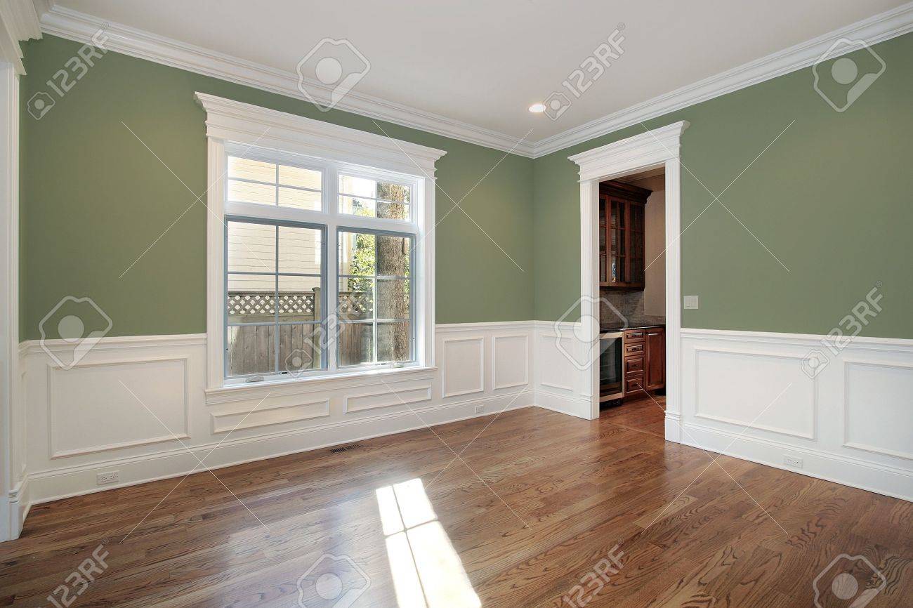 dining room in new construction home with green walls stock photo dining room in new construction home with green walls stock photo