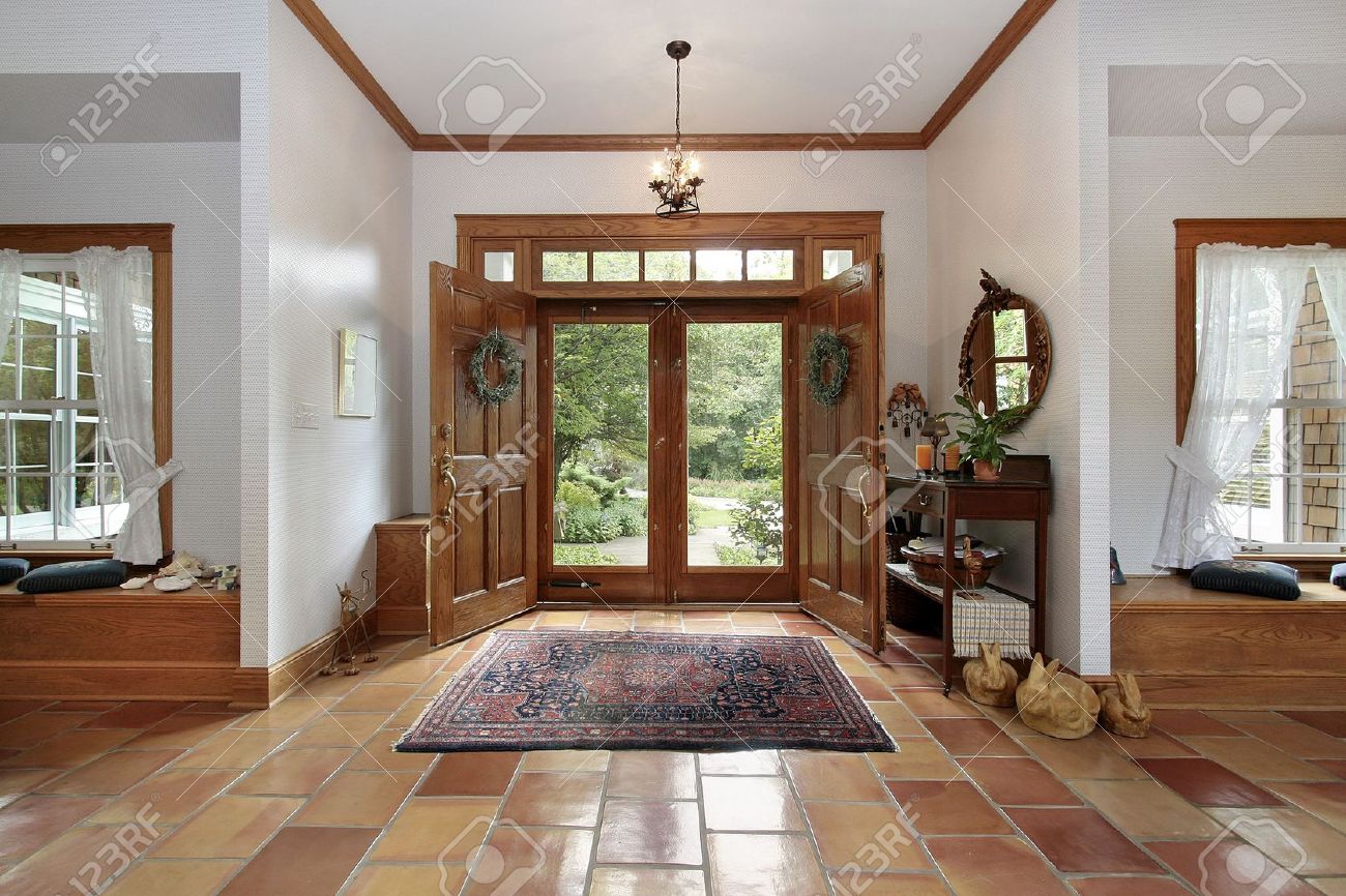 Foyer In Modern Home With Orange Ceramic Floors Stock Photo