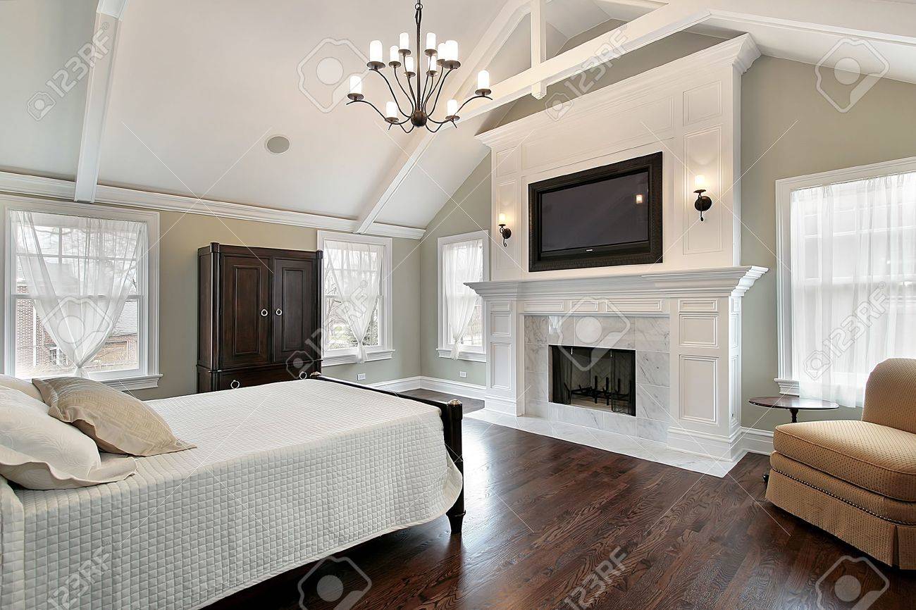 Luxury Homes Master Bedroom master bedroom in luxury home with marble fireplace stock photo Luxury Homes Master Bedroom master bedroom in luxury home with marble fireplace stock photo