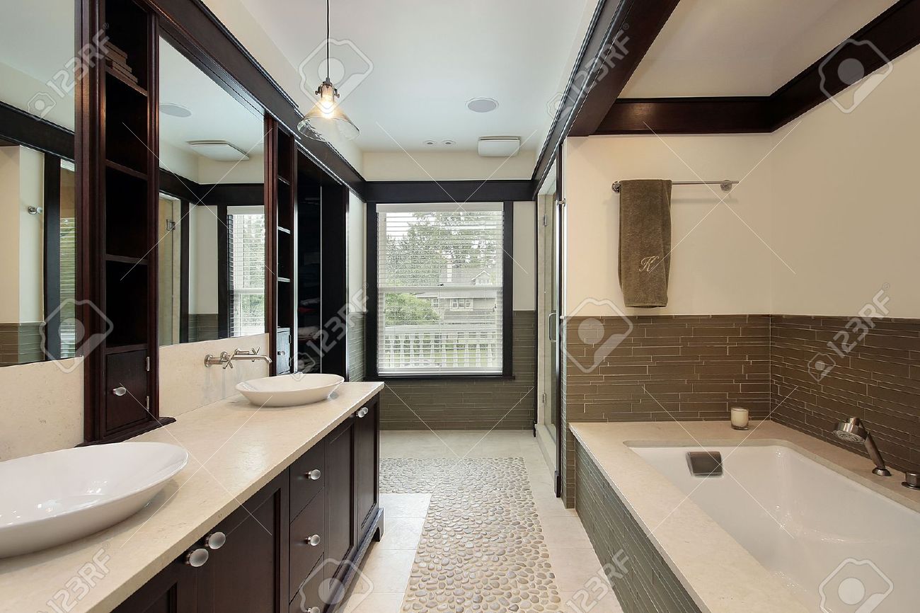 master bath in luxury home with dark wood trim stock photo master bath in luxury home with dark wood trim stock photo
