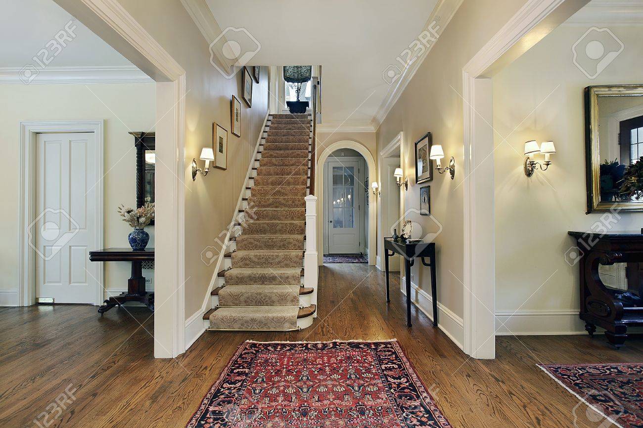 Foyer In Suburban Home With Dining And Living Room Entry Stock