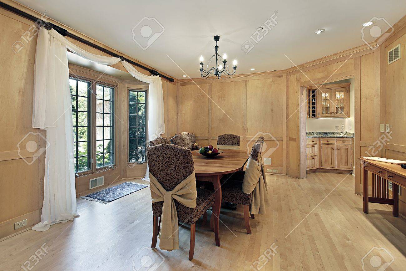 Dining Room In Luxury Home With Oak Wood Paneling Stock Photo