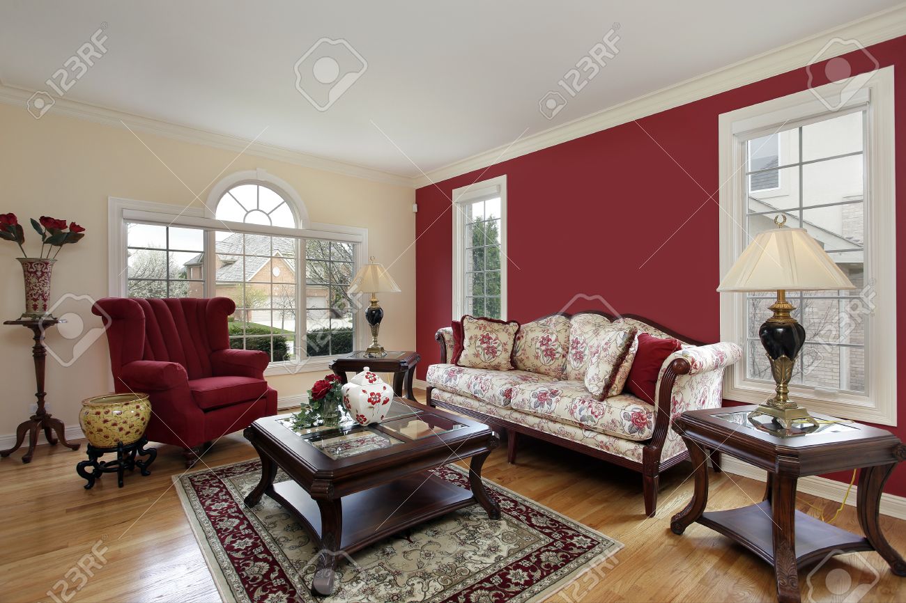 Living Room In Suburban Home With Red And Cream Colored Walls