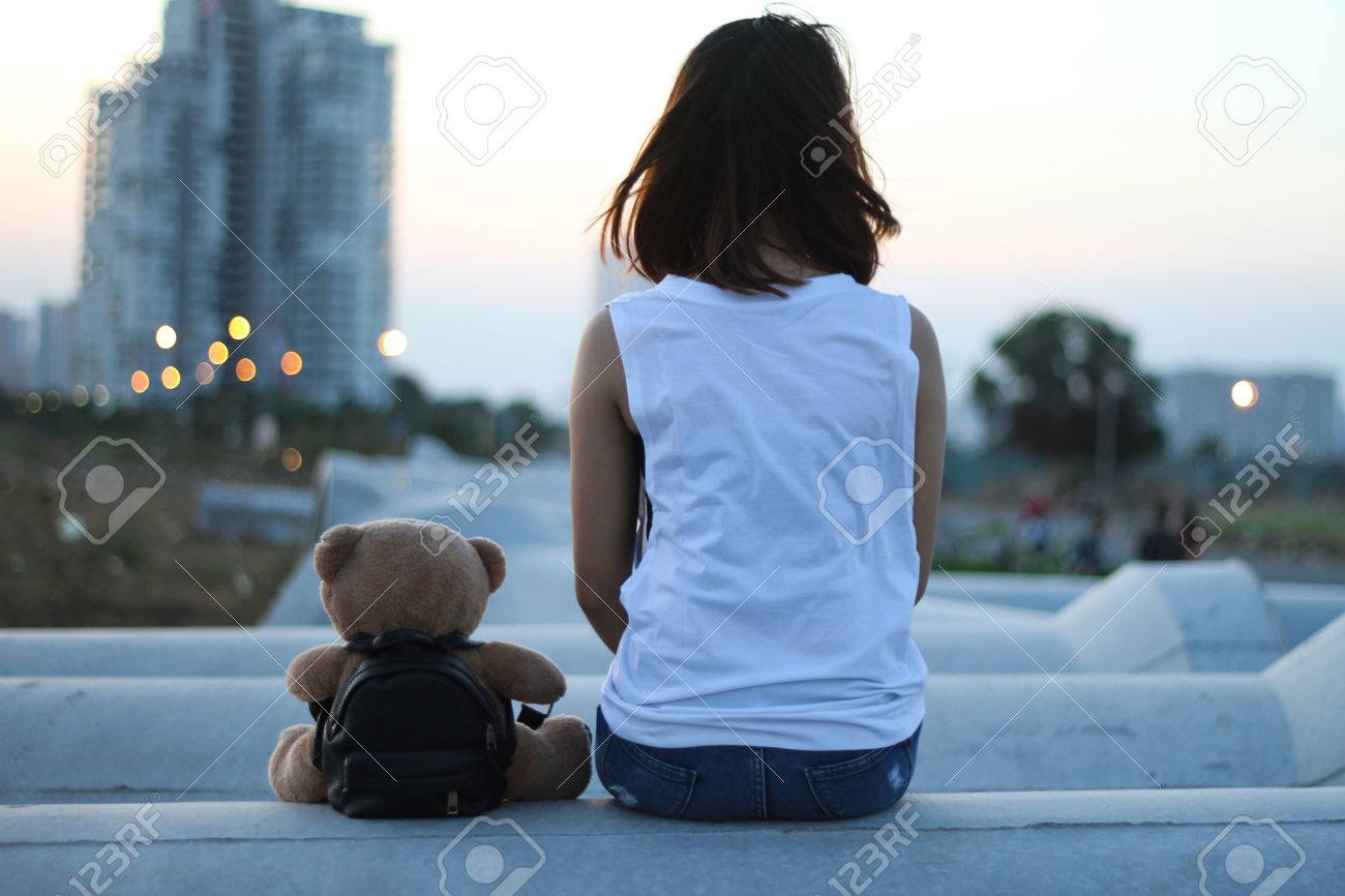a girl with teddy