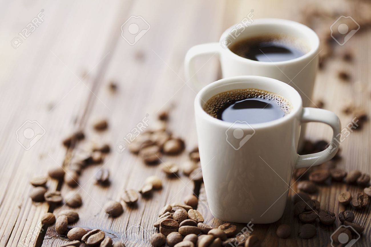 Two Modern Espresso Cups On A Wooden Table Stock Photo Picture - Two Modern Espresso Cups On A Wooden Table Stock Photo two modern espresso cups on a wooden table stock photo picture - two modern espresso cups on a wooden table stock photo