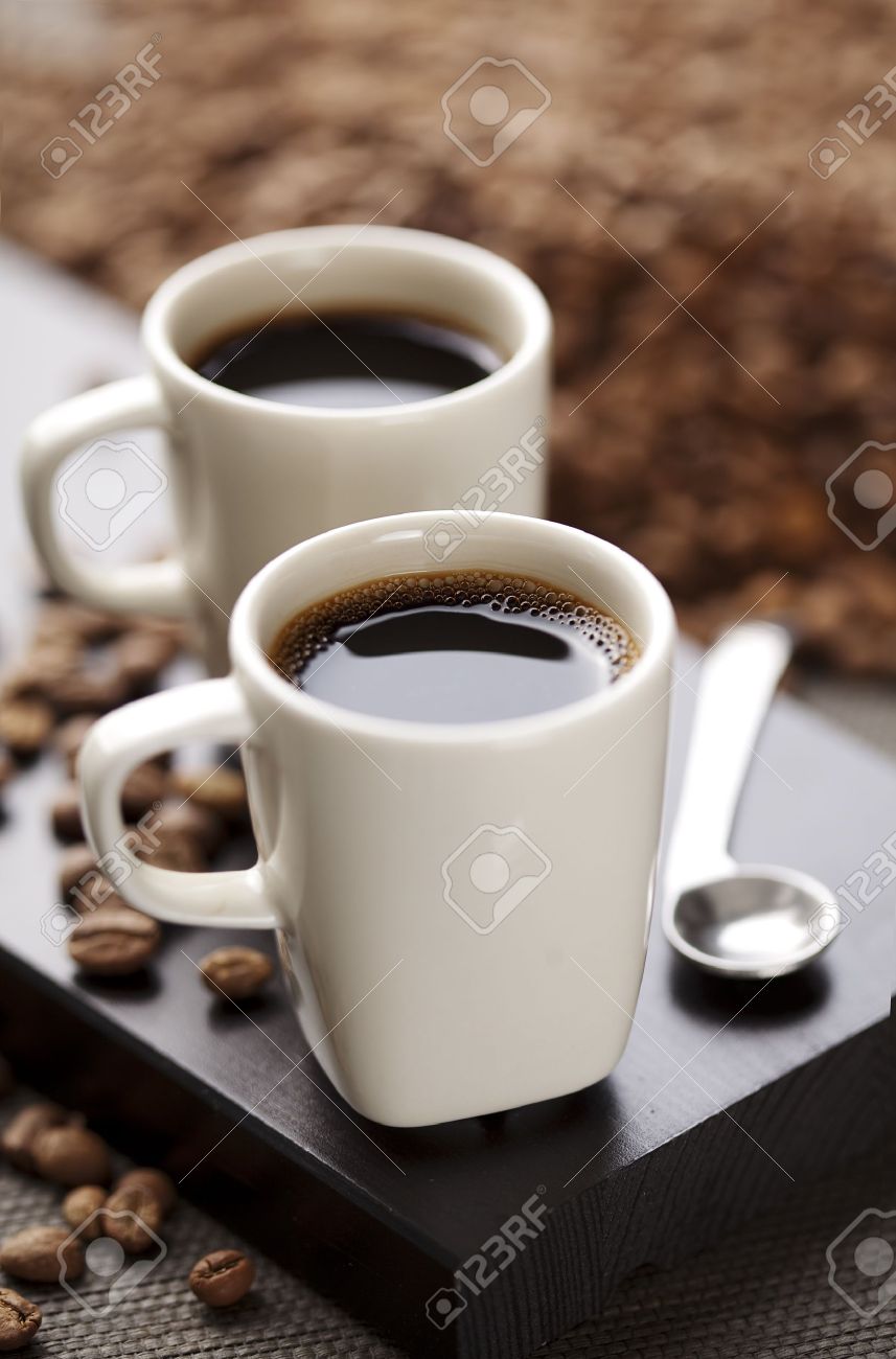 Two Modern Espresso Cups On A Wooden Table Stock Photo Picture - Two Modern Espresso Cups On A Wooden Table Stock Photo two modern espresso cups on a wooden table stock photo picture - two modern espresso cups on a wooden table stock photo