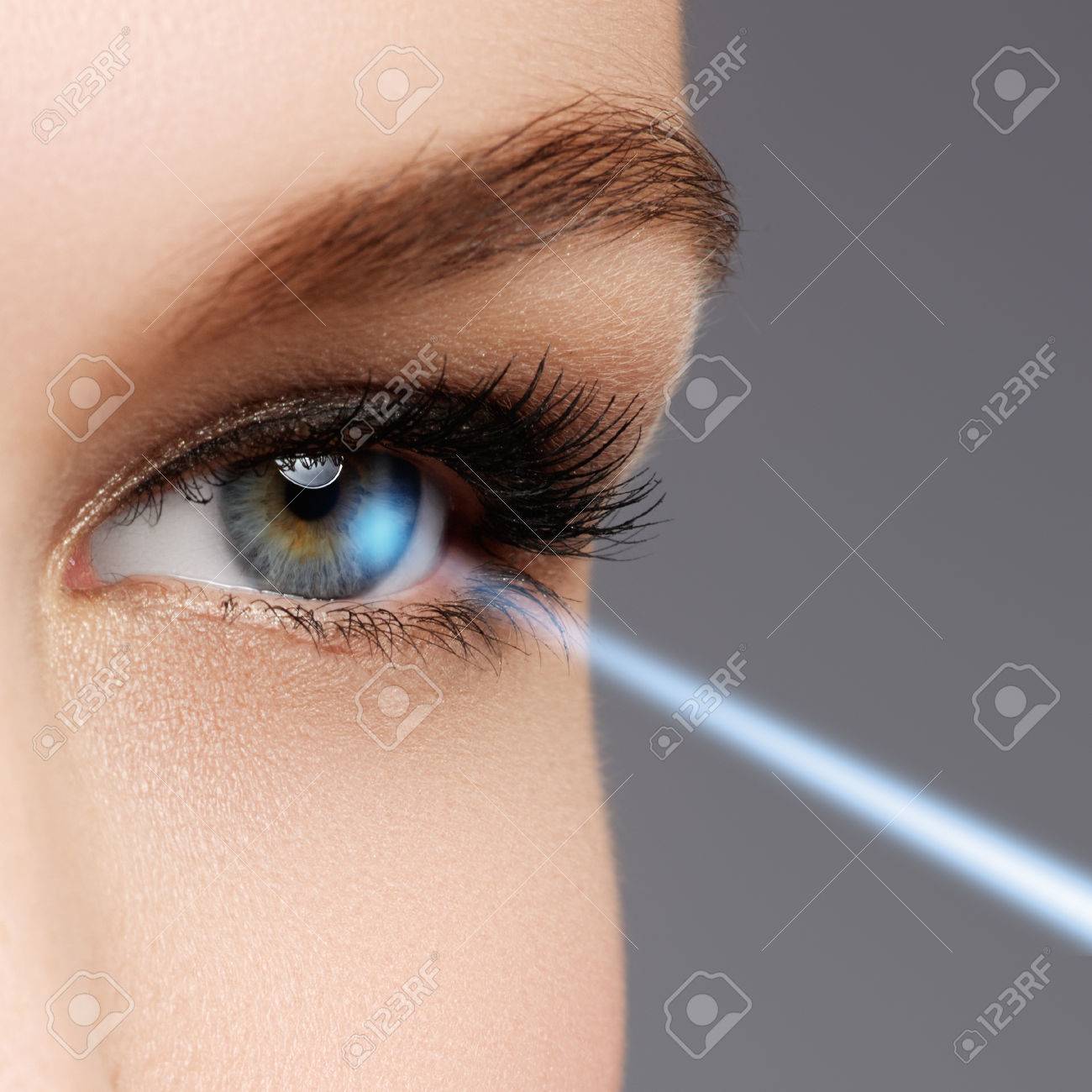 Laser vision correction. Woman's eye. Human eye. Woman eye with laser correction. Eyesight concept - 78135513 Laser vision correction. Woman's eye. Human eye. Woman eye with laser correction. Eyesight concept - 78135513