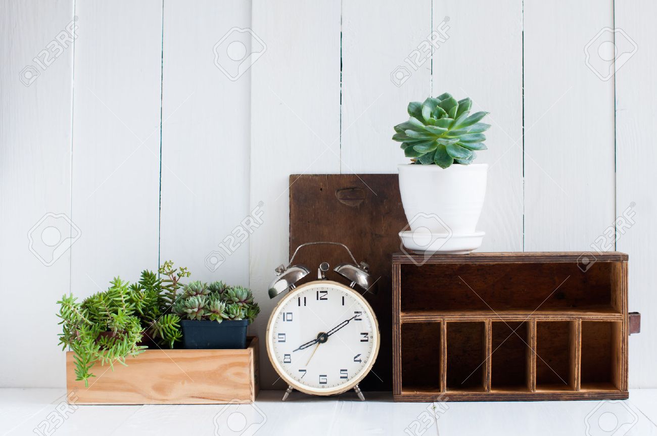 vintage home decor: old wooden boxes, houseplants, alarm clock vintage home decor: old wooden boxes, houseplants, alarm clock