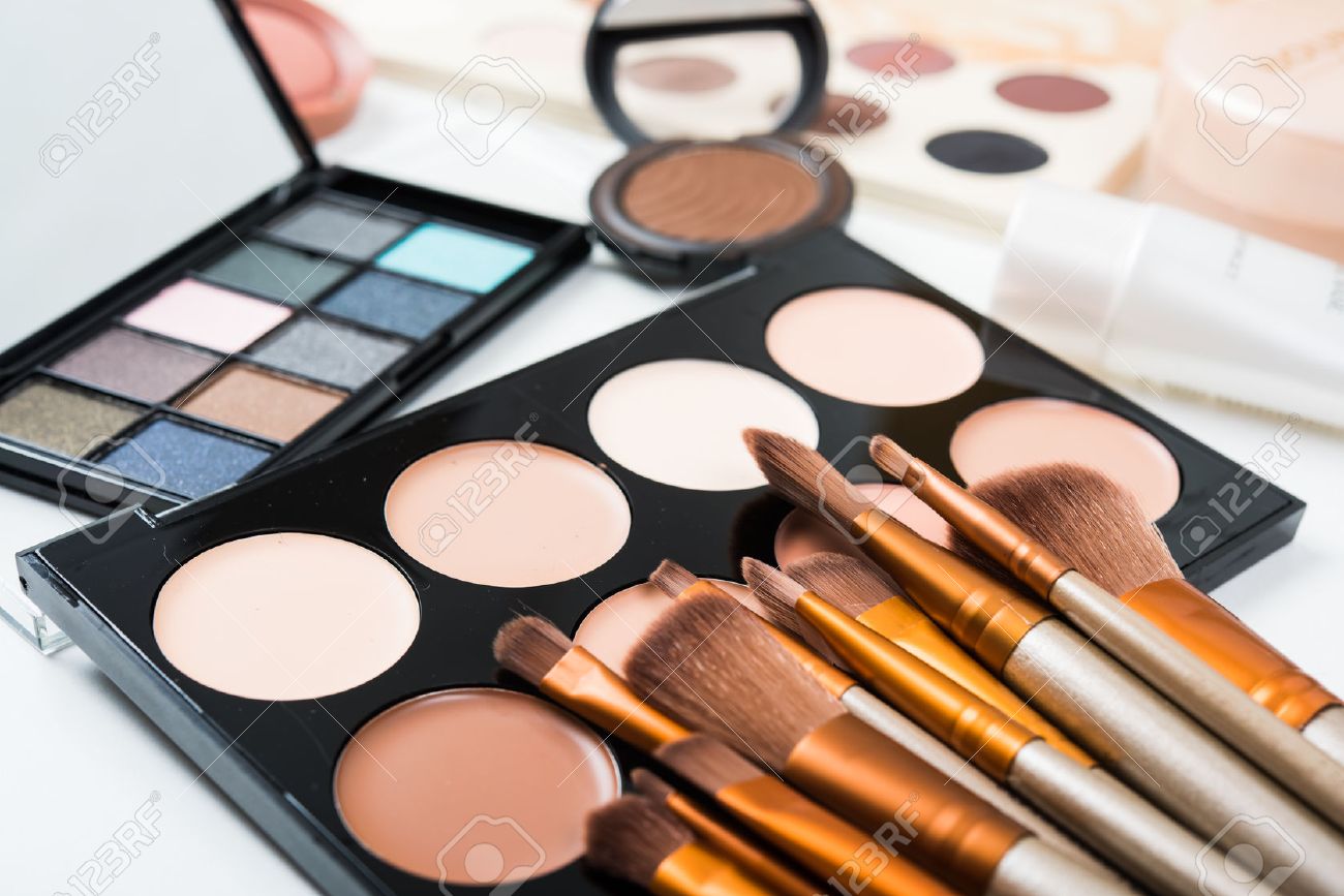 Professional makeup brushes and tools, natural make-up products set, eyeshadows and concealers on white table. - 60728819 Professional makeup brushes and tools, natural make-up products set, eyeshadows and concealers on white table. - 60728819