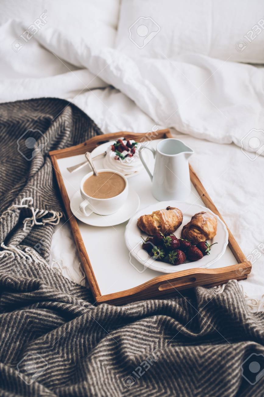 Traditional Romantic Breakfast In Bed In White And Beige Bedroom