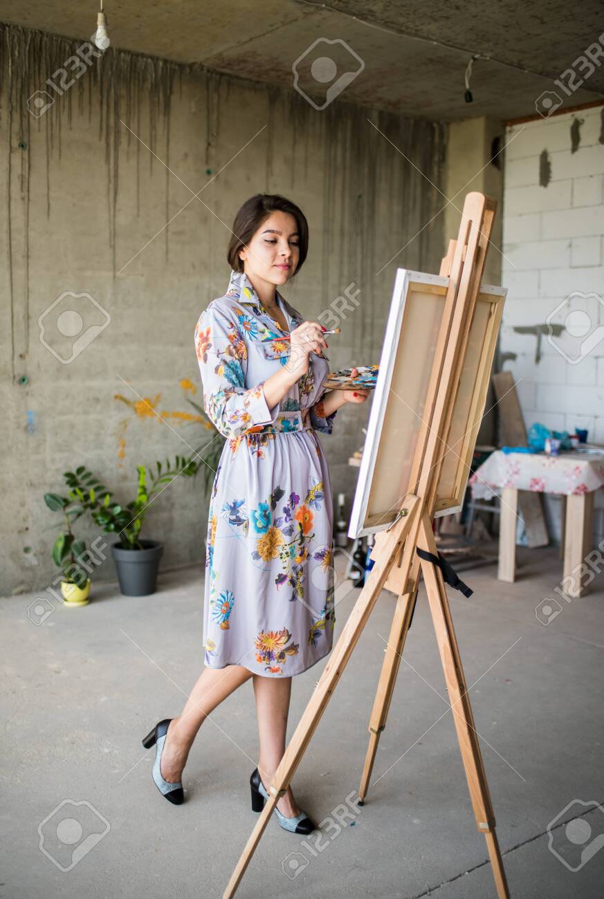 Young Beautiful Lady Painter In Dress, Woman Artist Painting Stock Photo,  Picture and Royalty Free Image. Image 122584733., image size:873x1300
