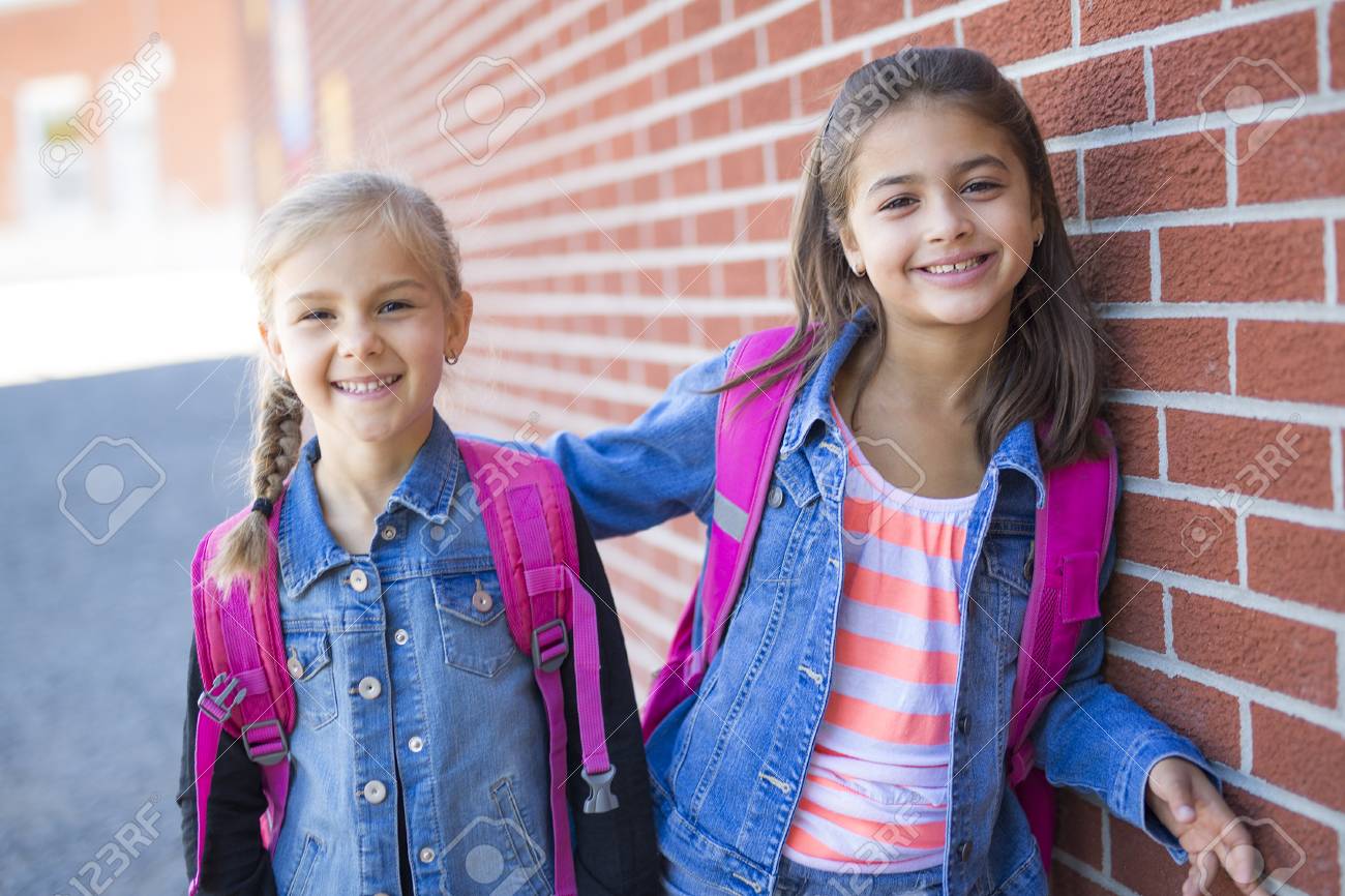 Two Childs Girls Elementary School Outside Stock Photo, Picture and Royalty  Free Image. Image 86893377.