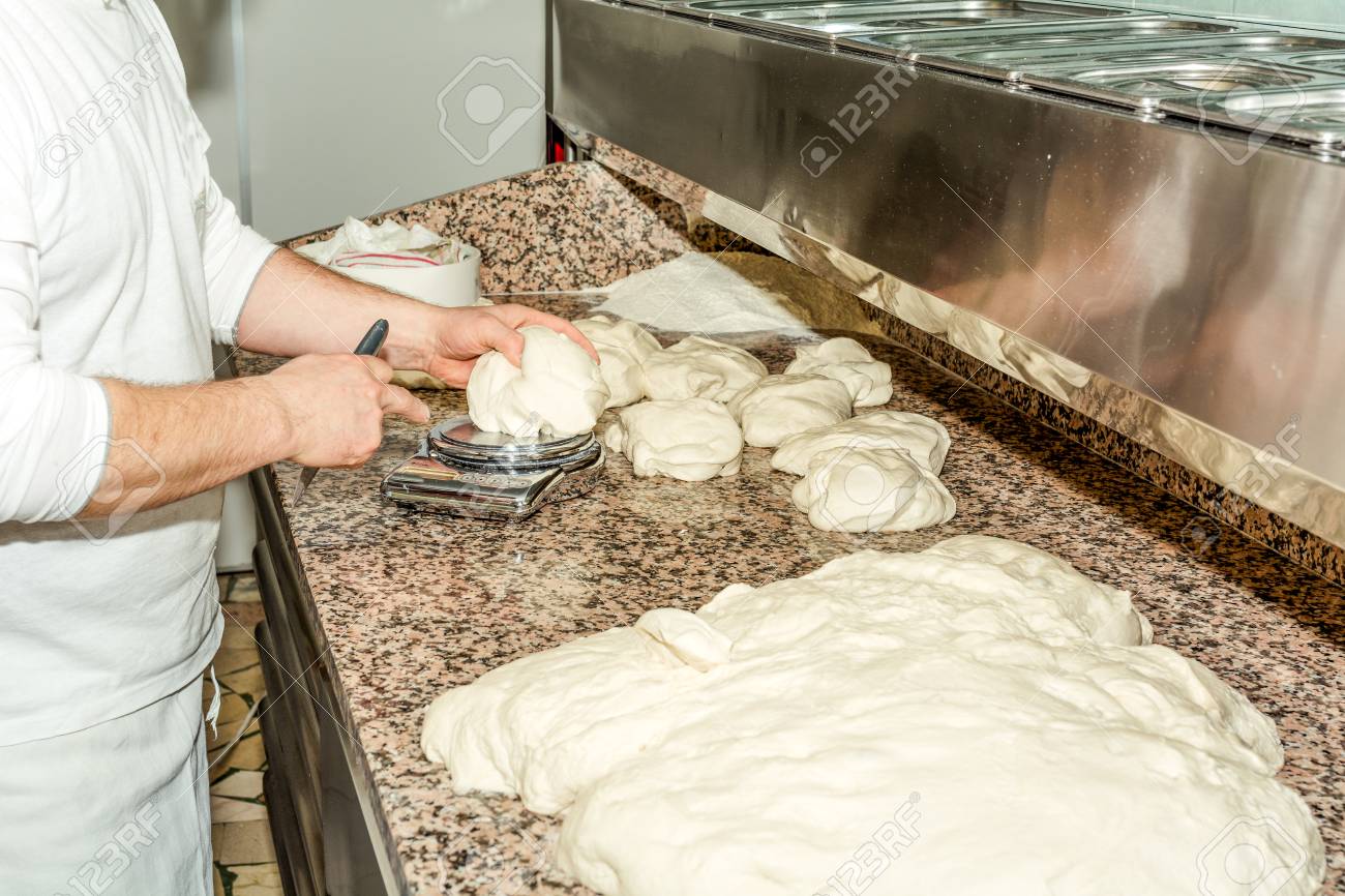 The Chefs Hands Knead Dough To Make Pizza In Kitchen The Chefs Hands Knead Dough To Make Pizza In Kitchen