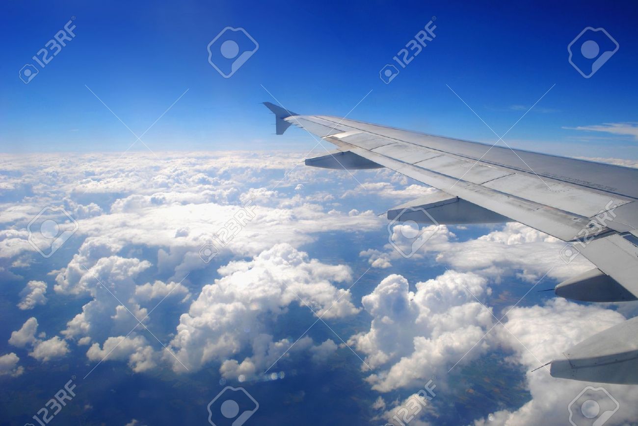 plane wing flying above the clouds stock photo picture and royalty