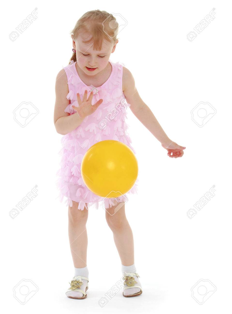 ilittle girl tosses the ballsolated on white background, sports life,happiness concept,happy childhood,carefree childhood,active lifestyle - 29730684 ilittle girl tosses the ballsolated on white background, sports life,happiness concept,happy childhood,carefree childhood,active lifestyle - 29730684