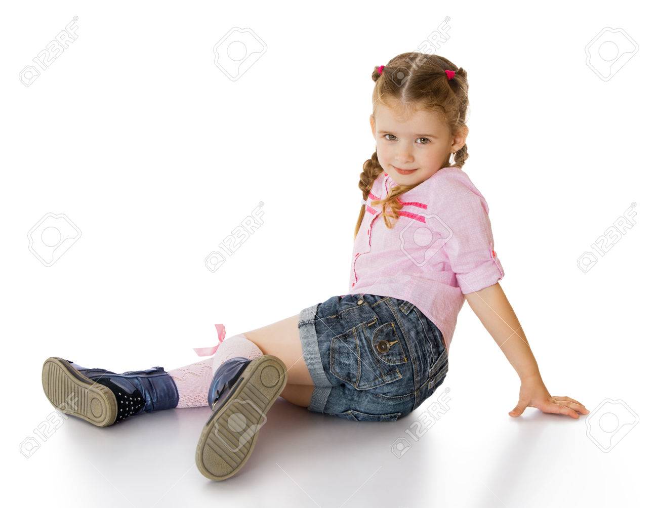 Pretty Little Green Eyed Girl With Blond Hair Braided In Pigtails