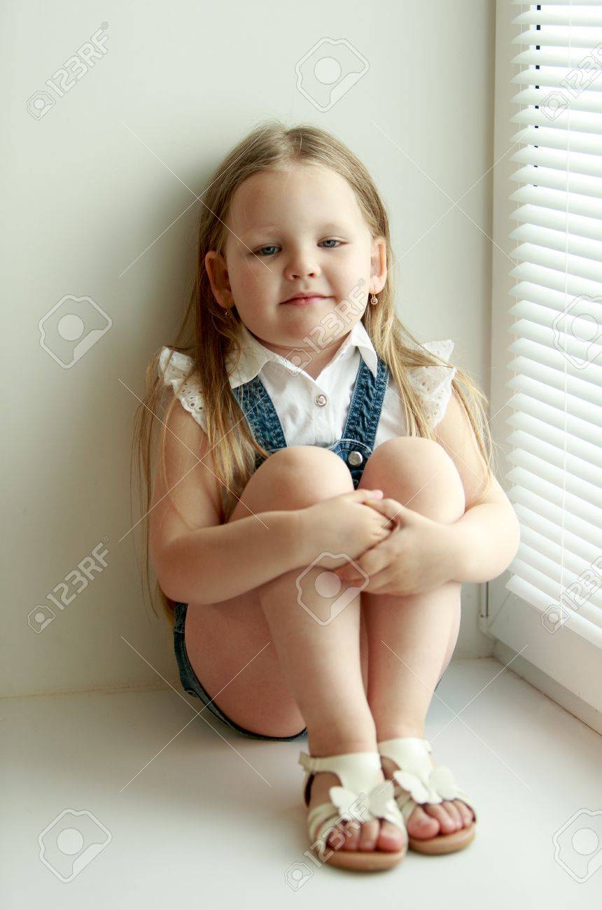 little girl in denim shorts
