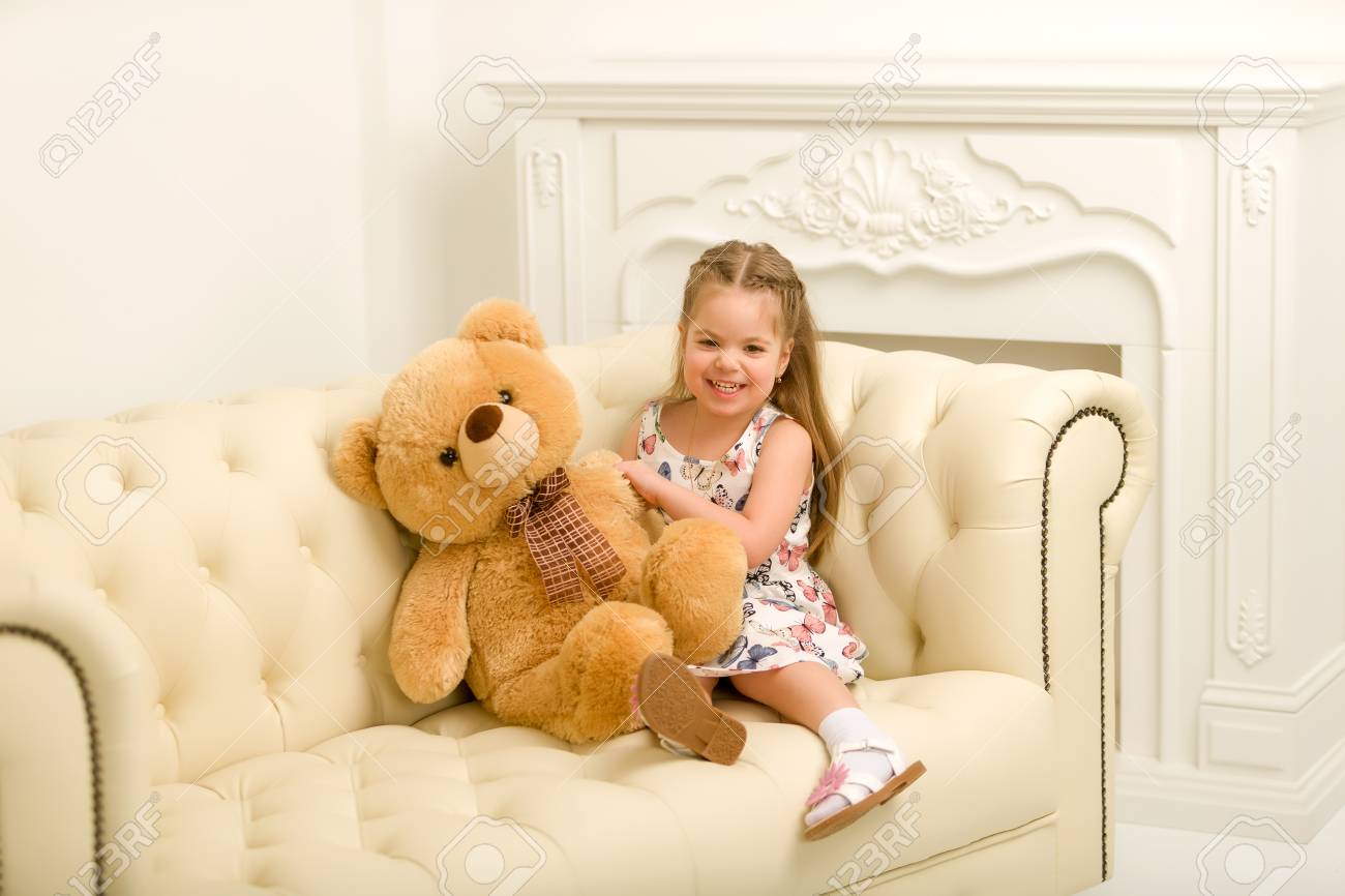 teddy bear and little girl