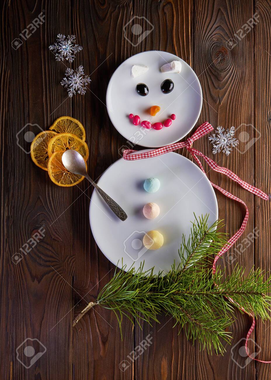 Funny snowman - Christmas and New Year fun food art. Top view - 131905226 Funny snowman - Christmas and New Year fun food art. Top view - 131905226