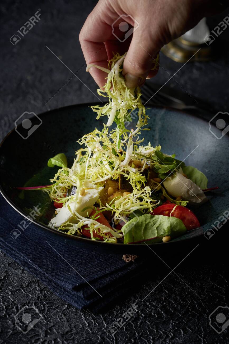 Chef hands preparing vegetable salad - 132782609 Chef hands preparing vegetable salad - 132782609