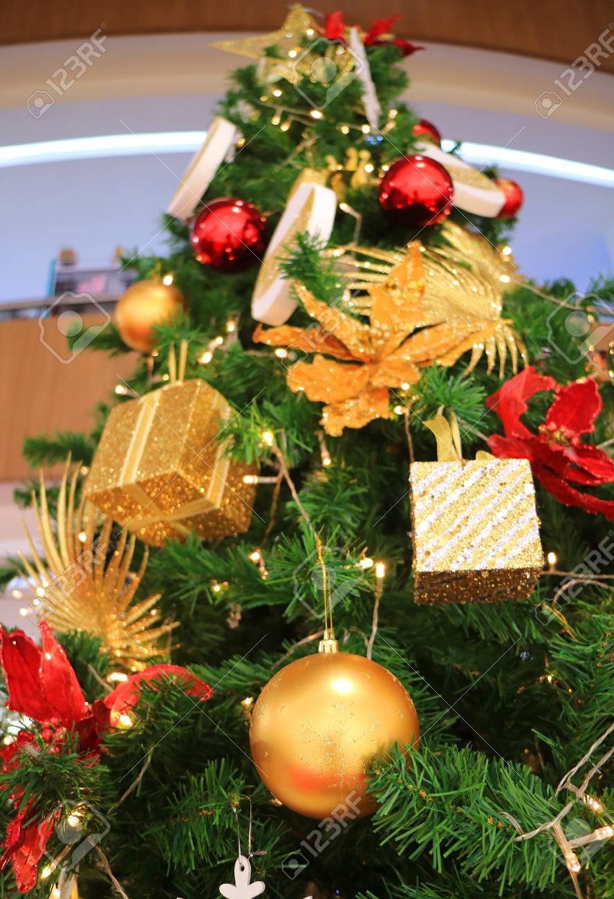 low angle view of a decorated big christmas tree full of gorgeous big christmas tree ornaments