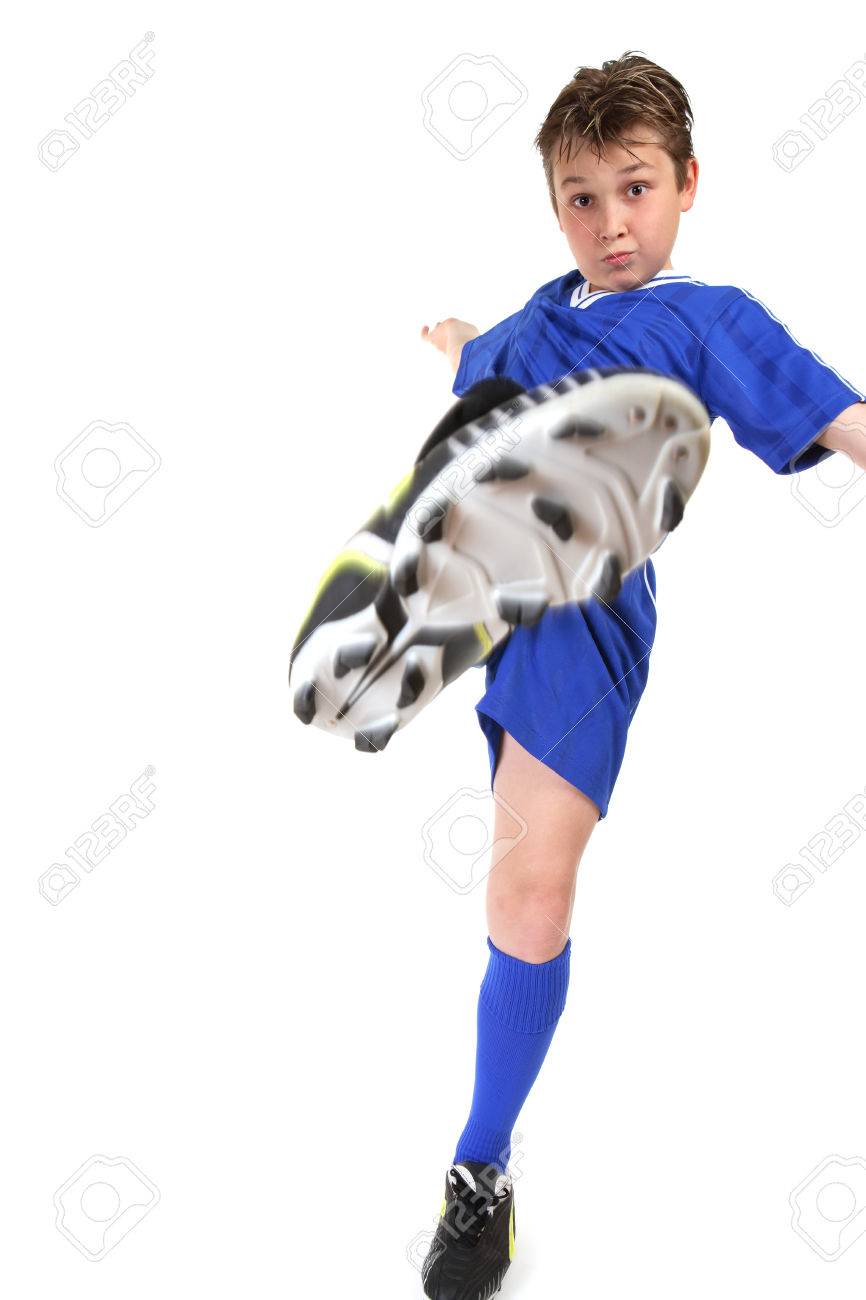 a boy kicks high kicking leg in motion stock photo picture and