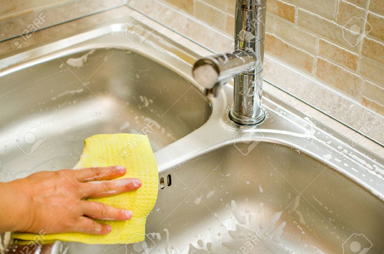 woman hand doing chores cleaning modern kitchen sink gray - 53920672 woman hand doing chores cleaning modern kitchen sink gray - 53920672