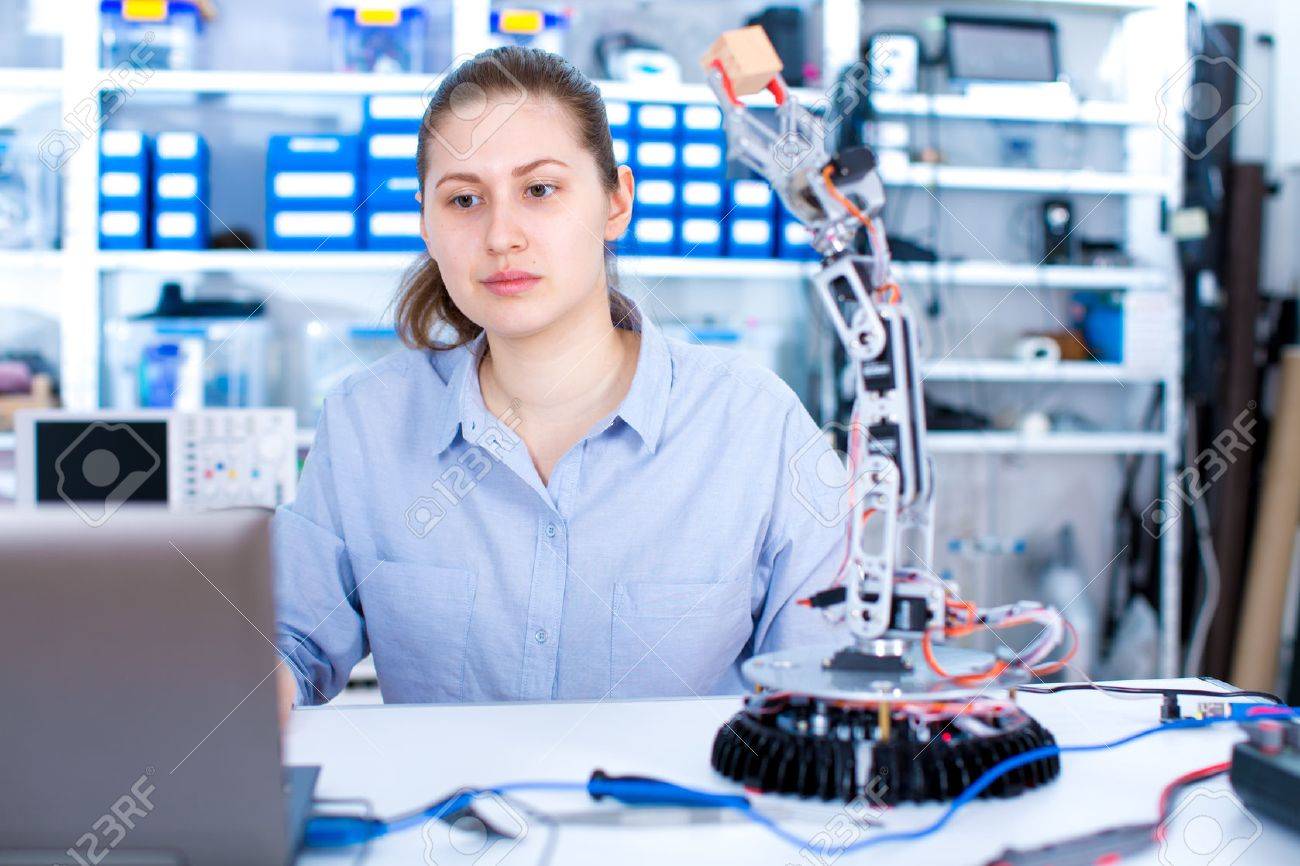 girl in robotics laboratory young woman technician repair roboter robotics technition