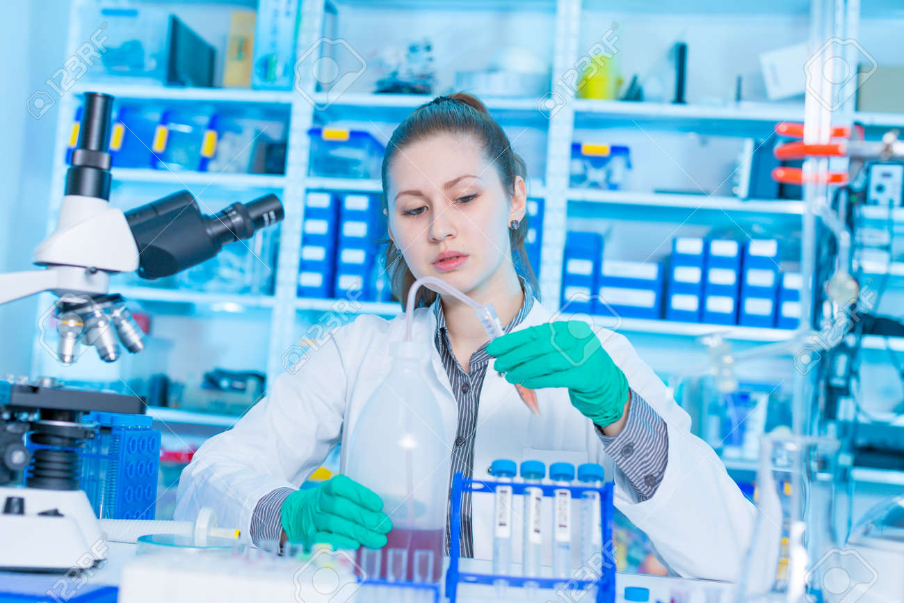 Young female laboratory assistant in laboratory analyzing environmental pollution - 156699356 Young female laboratory assistant in laboratory analyzing environmental pollution - 156699356
