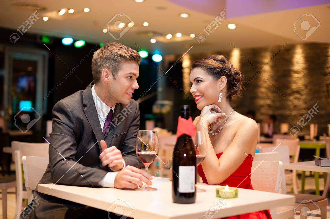 Young Couple On First Date In Romantic Restaurant Stock Photo, Picture And Royalty Free Image. Image 17803974.