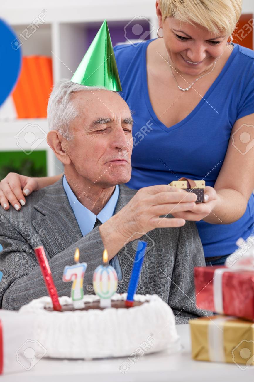 Daughter Gives Father Gift For 70th Birthday Stock Photo Picture And Royalty Free Image Image