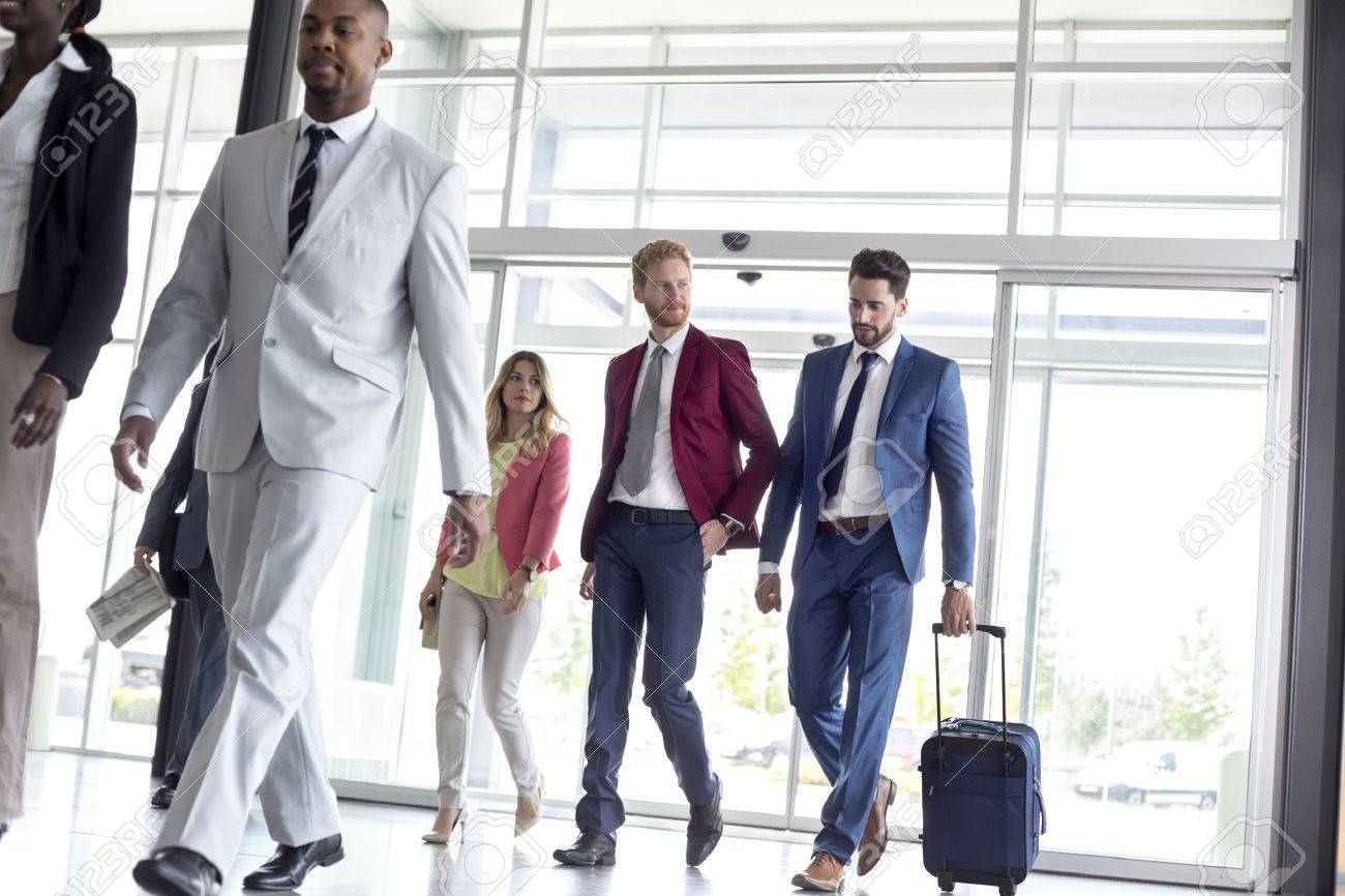 Young multiethnic international tourists arrive in airport waiting room - 54232261 Young multiethnic international tourists arrive in airport waiting room - 54232261