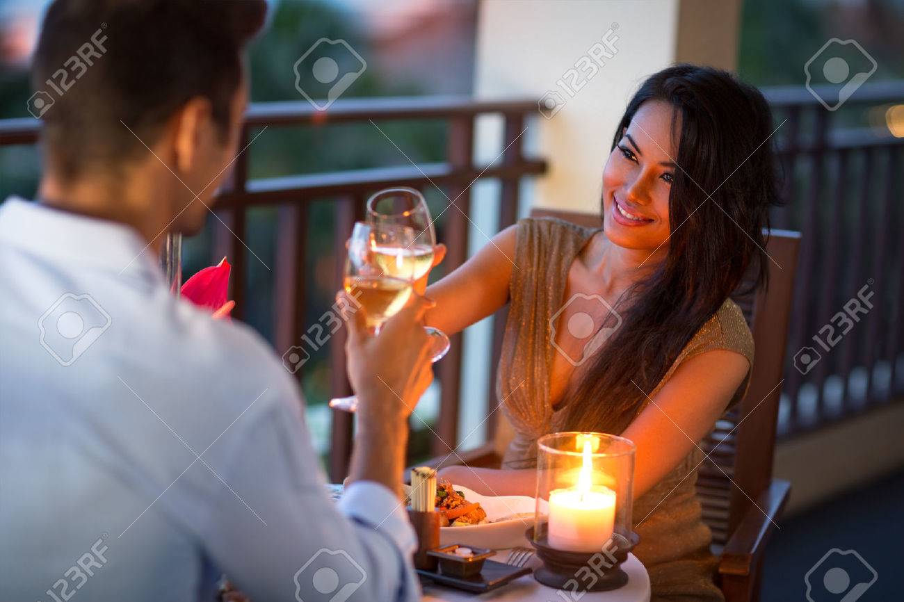 Couple having intimate dinner for two on the terrace of summer evening - 51516866 Couple having intimate dinner for two on the terrace of summer evening - 51516866